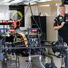 A Lotus F1 E22 is prepared in the pits