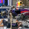 A Red Bull Racing RB10 is prepared in the pits