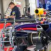 A Red Bull Racing RB10 is prepared in the pits