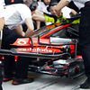 McLaren practice a front wing change in a pit stop