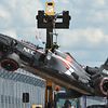 Crashed Sauber brought back to pitlane