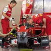 A Ferrari F14-T is prepared in the pits
