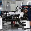 The Williams FW37  is prepared in the pit garage